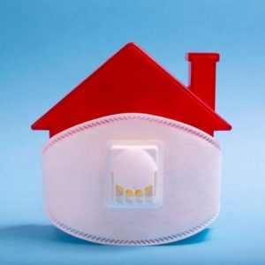 The truth about real estate investing in a pandemic - house with face mask