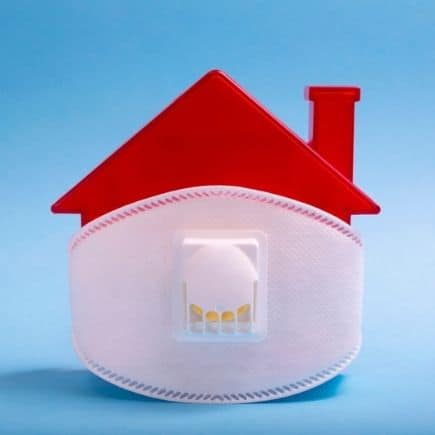 The truth about real estate investing in a pandemic - house with face mask