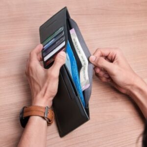 Hands holding open wallet
