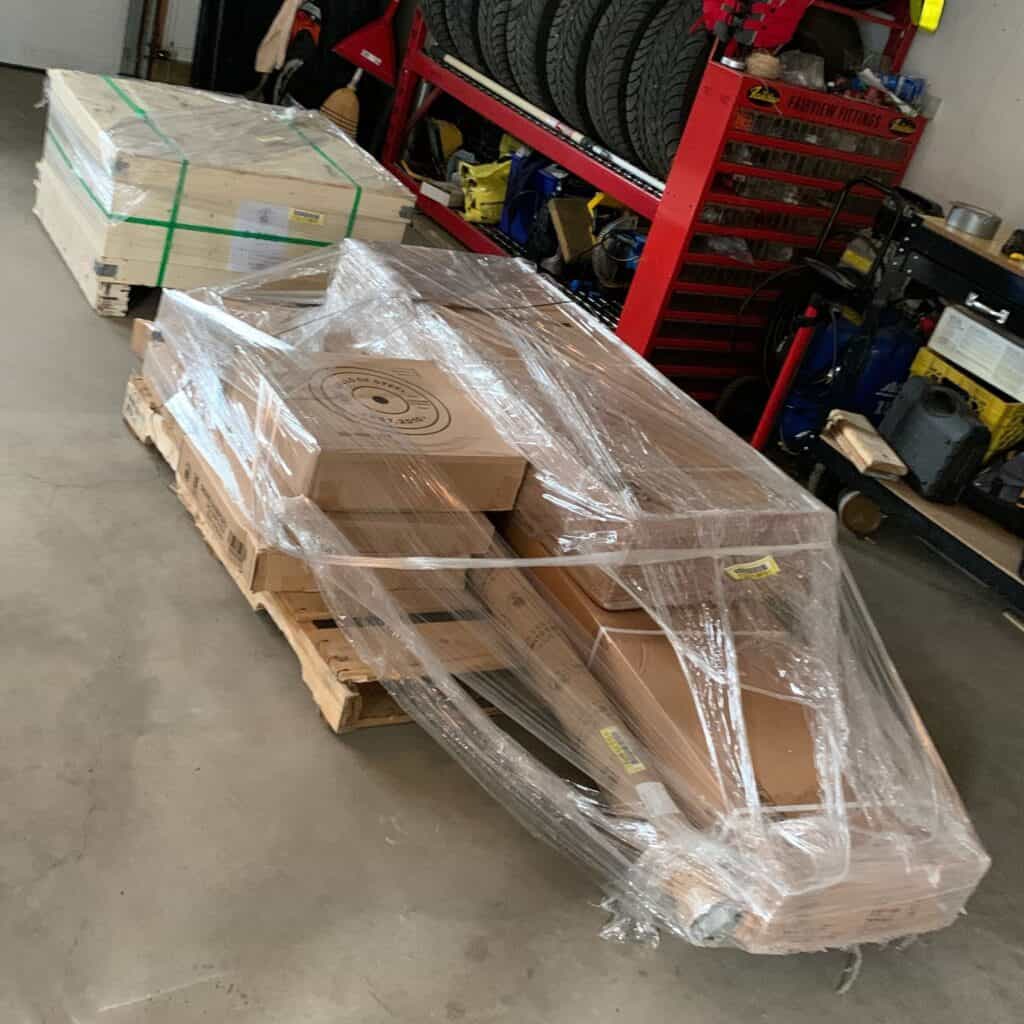 Crate and pallet of home gym equipment from Bells of Steel