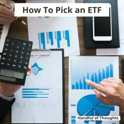 papers with charts and a calculator while 2 people try to decide how to pick an etf.